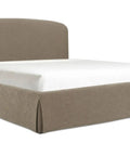 Beige upholstered bed frame with white mattress on a white background