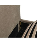 Close-up of a textured fabric surface with a zipper partially open on a white background